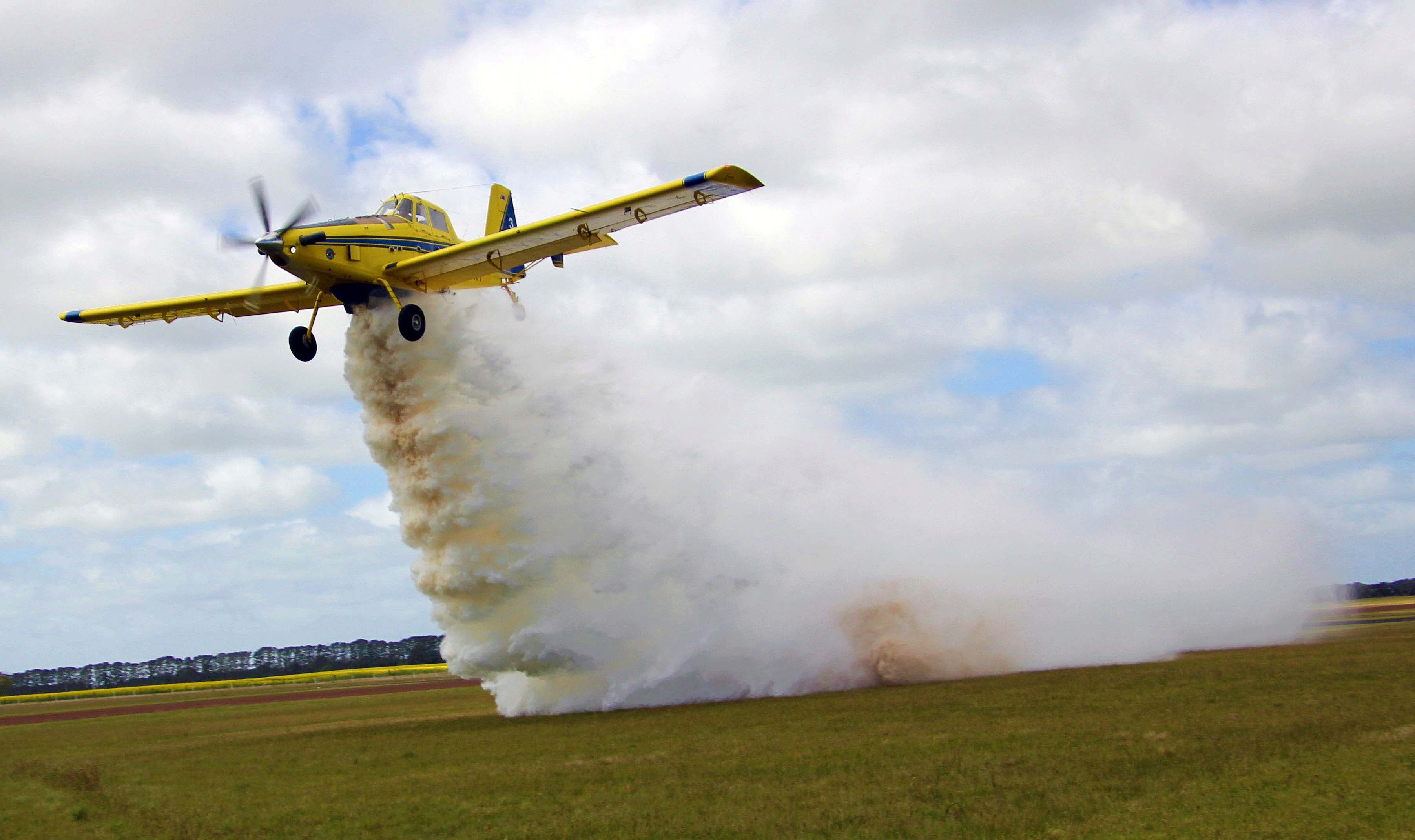 Image of fire bombing plane dropping water